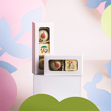 Osterpralinen Küken mit Haselnussfüllung und Praline mit essbarem Aufdruck für Unternehmen