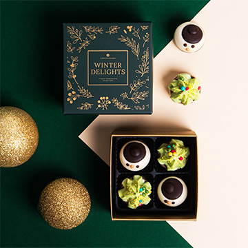 Schokoladenpralinen mit Weihnachtsmotiv verziert